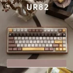 Whimsical Butter Bear tri-mode mechanical keyboard in a warm hues, showcasing its delightful design and vibrant RGB backlighting from multiple angle.