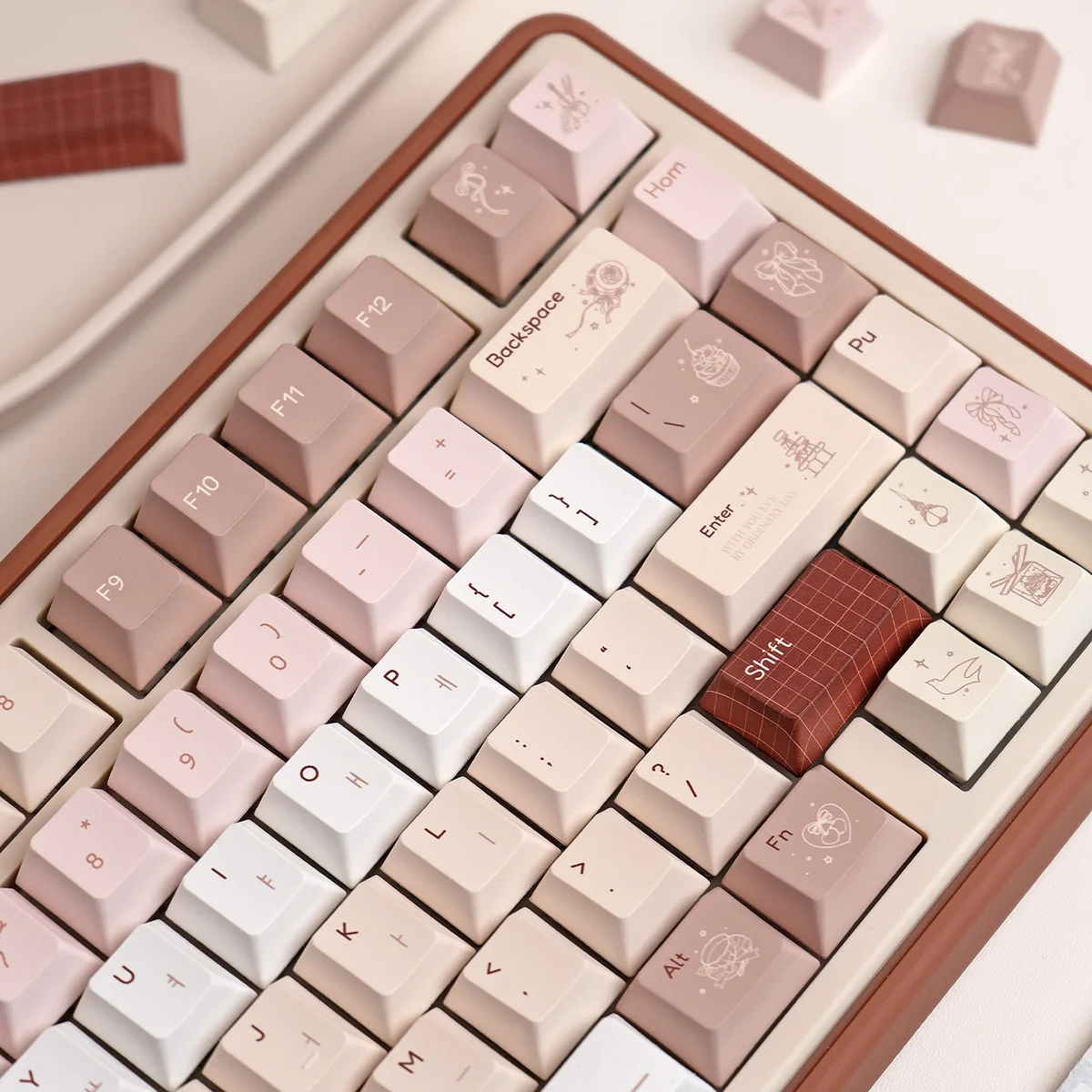 A gallery view of the UR82 Caramel Isle Tri-Mode Mechanical Keyboard, showing its cute milk brown and caramel design from a playful angle.