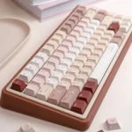 Close-up of the UR82 Caramel Isle tri-mode mechanical keyboard, highlighting its cute warm caramel brown keycaps and quiet typing experience.