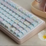 A playful collection of images showcasing the Cute Puppy Tri-Mode Mechanical Keyboard from various angles, highlighting its pastel colors.