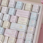 Cute puppy tri-mode mechanical keyboard from a different angle, highlighting its playful pastel motifs, soft color palette, and vibrant RGB lighting.