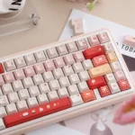 Cute UR82 Strawberry Dessert tri-mode mechanical keyboard, showing sweet pastel hues keys with creamy accents from a charming angle.