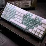 West Lake Keycaps Set: Three-tone PBT OEM keycap set in serene West Lake inspired tranquil hues. Multiple angles reveal subtle side legends.