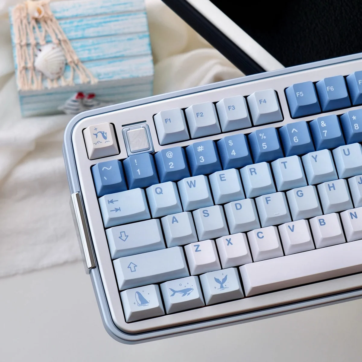 Ethereal Whale Dream PBT Keycaps Set shown from multiple artistic angles, highlighting the tranquil whale and cloud designs. Durable PBT.
