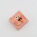 Close-up of a whimsical Big Mouth Star resin artisan keycap, showcasing its unique handcrafted details and quirky five-pointed star design.