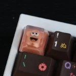 Vibrant, handcrafted whimsical big mouth star resin artisan keycap, showcasing its unique, quirky design.