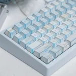 Geometric PBT Winter Keycap Set. Multiple views reveal side-printed legends, minimalist winter aesthetic, and captivating light and shadow.