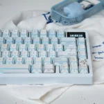 Winter Letter Series Folded Shadow Keycap Set, viewed from an artistic angle, highlighting the crisp lines and minimalist winter aesthetic.