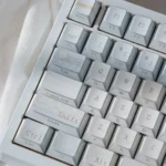 Winter Letter Keycap Set. Geometric, PBT keycaps display a minimalist winter aesthetic, side-printed legends reflecting light.