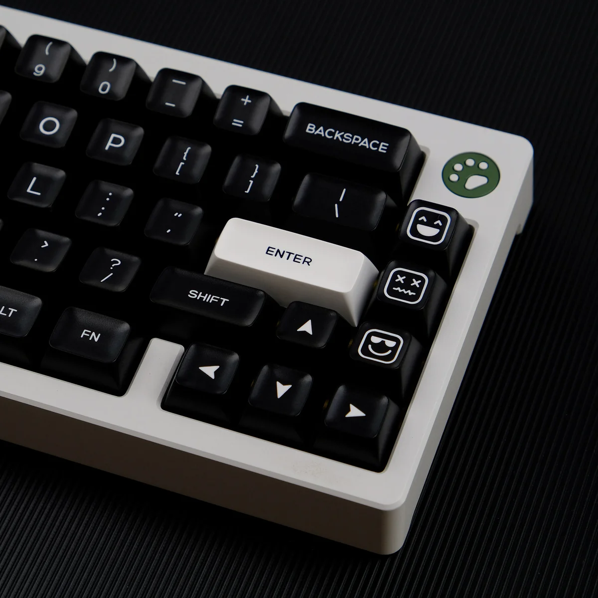 Close-up of the WOB PBT Keycap Set, revealing its striking black and white contrast and ergonomic QXA profile. Durable PBT ensures timeless, minimalist design.