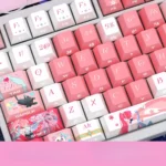 Wuthering Waves Aemeath side-lit PBT keycaps set, from multiple angles, showcasing their futuristic design and radiant translucent legends for an immersive design.