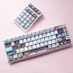 Yier & Bubu PBT Dye-Sub Keycap Set. Exclusive artistic keycaps feature charming, soft-colored illustrations and translucent PC accents. All angles.