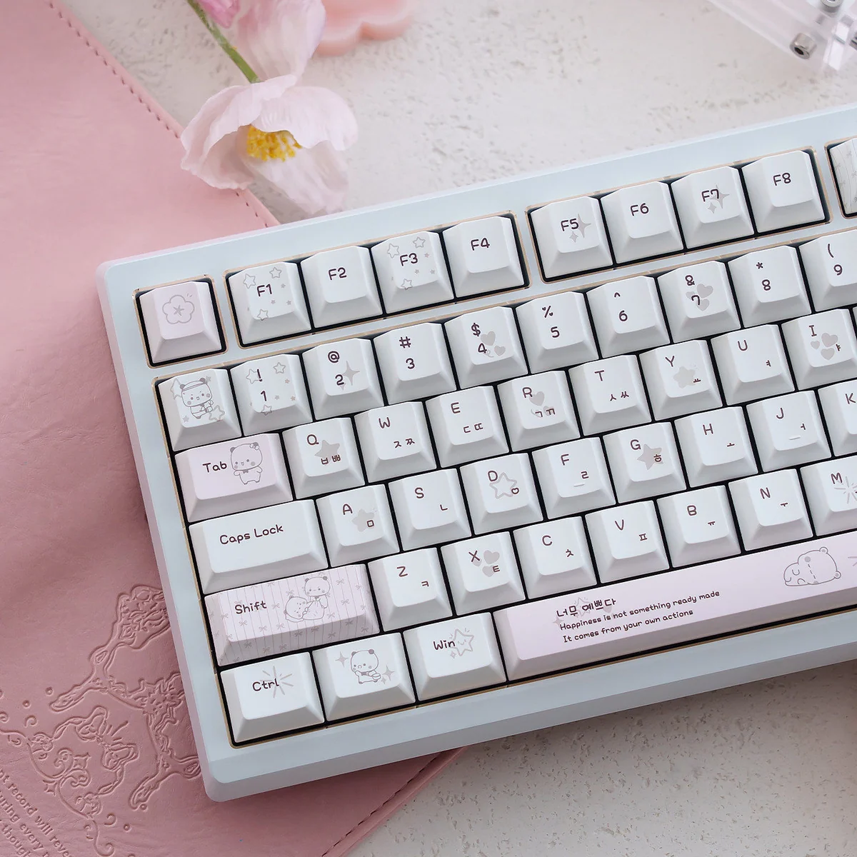 Close-up of a Yier & Bubu PBT dye-sublimated keycap set, revealing the whimsical character art and vibrant, long-lasting legends from a unique angle.