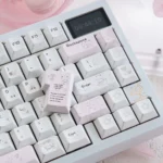 Whimsical Yier & Bubu PBT dye-sublimated keycaps art set, shown from various angles, highlighting vibrant character designs and long-lasting legends.