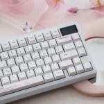 Whimsical Yier & Bubu PBT dye-sublimated keycaps set, displayed from various angles. Features vibrant, unique character art for an artistic keyboard.