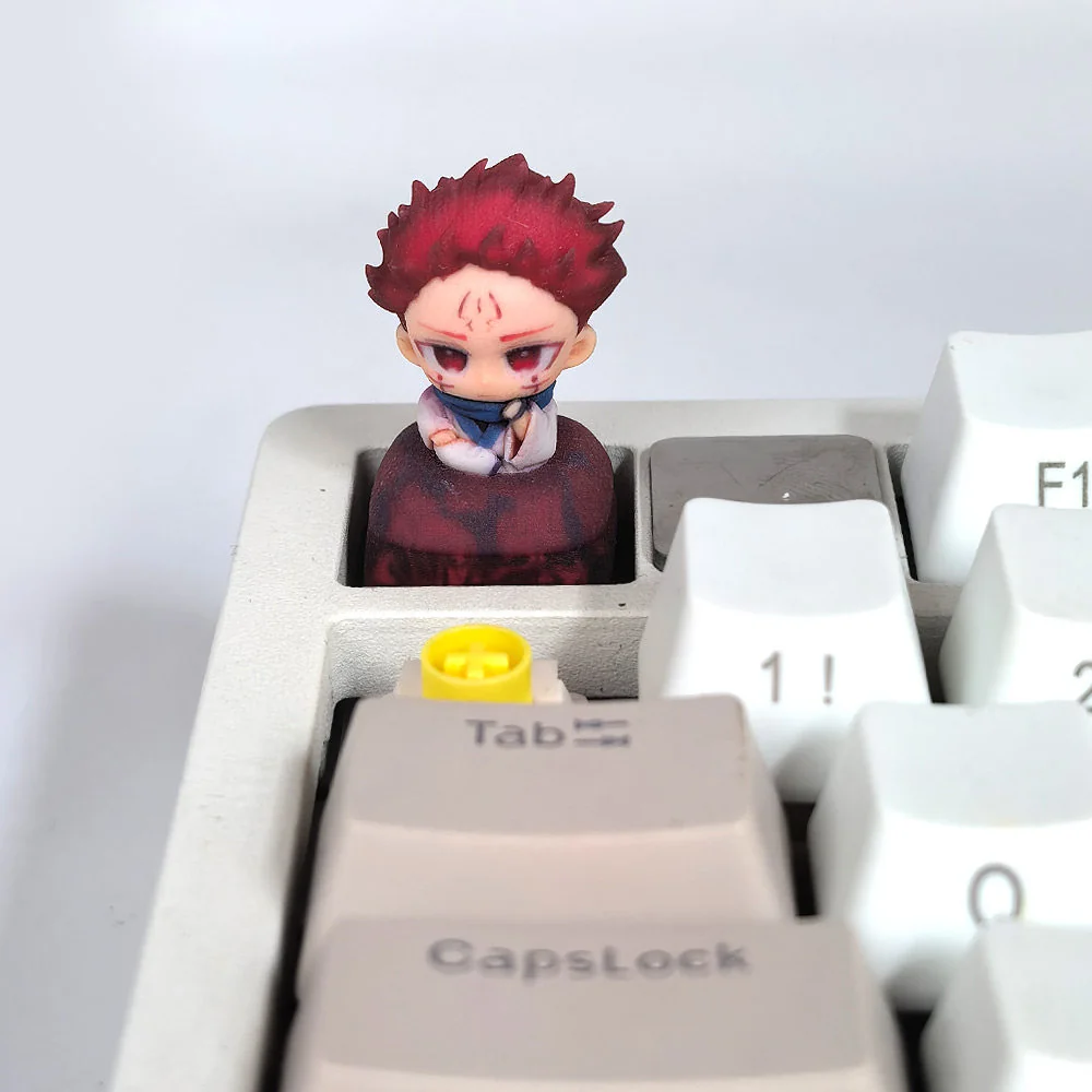 Detailed view of the exclusive 3D Yuji Itadori keycap, showcasing vivid Jujutsu Kaisen character with premium resin finish from an artistic angle.