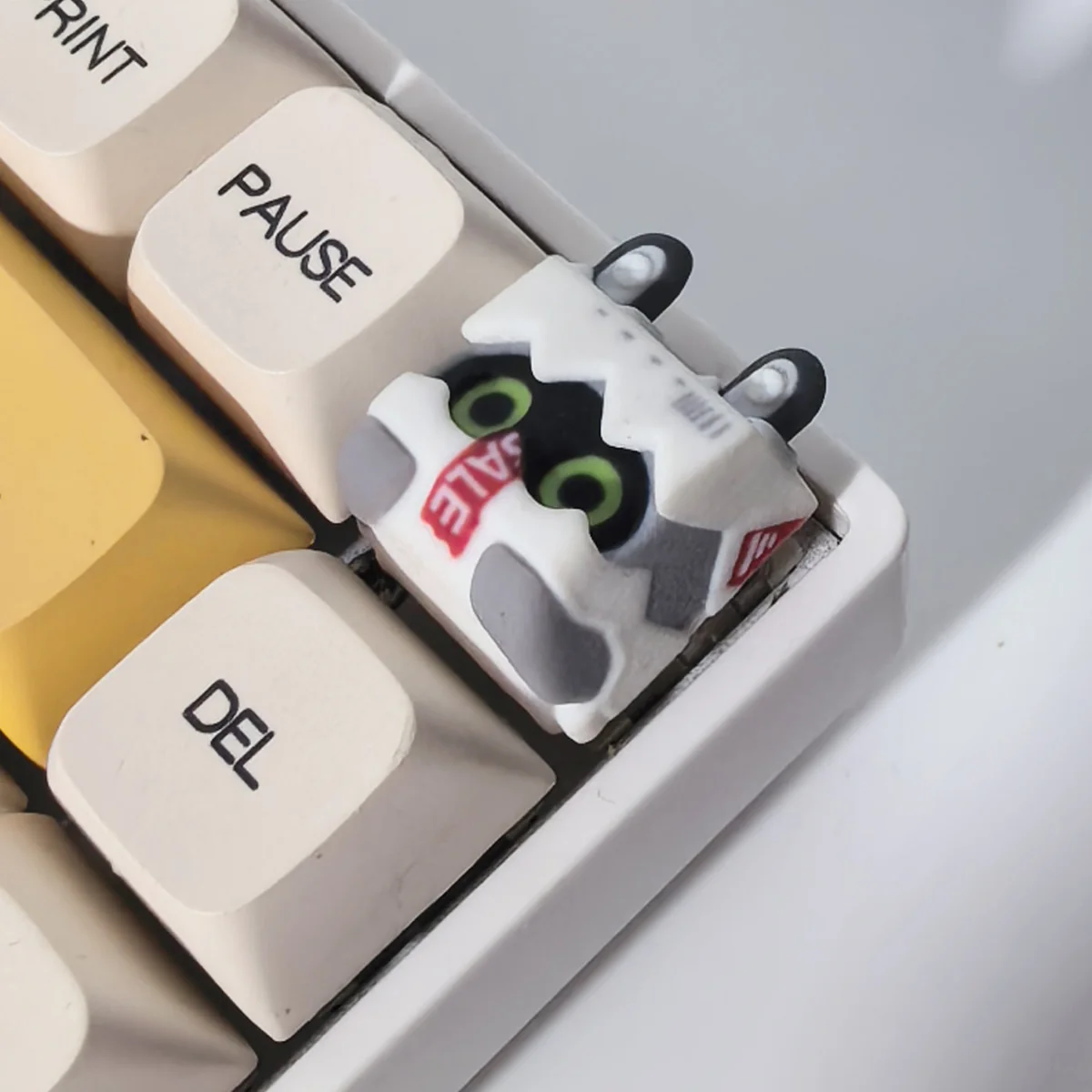 Handcrafted Zenless Zone Zero Bangboo artisan keycap, vibrantly 3D sculpted with game-accurate details and a playful pose, shown from various angles.