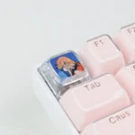 Exclusive Zero Two keycap from DARLING in the FRANXX, showcasing vibrant anime design and iconic pink/red hues from various premium angles.