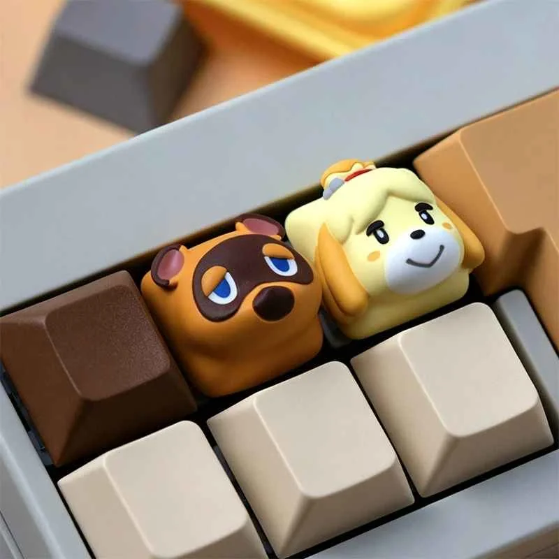 A charming, handcrafted Animal Crossing resin keycap, vividly displaying beloved characters Tom Nook and Isabelle with artistic detail from a unique design.