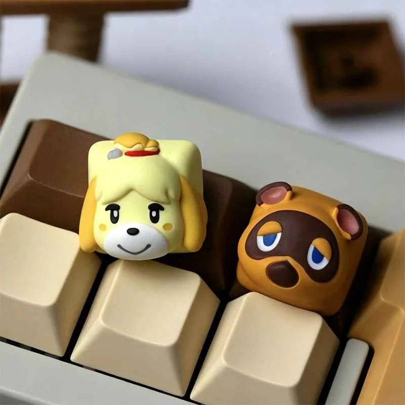 Main image of charming handcrafted Animal Crossing resin keycaps, featuring beloved characters Tom Nook and Isabelle.