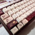 Antiquing Love Letter PBT keycaps, showcasing their unique vintage aesthetic and muted tones from multiple angles. Evokes cherished, aged romantic letters.