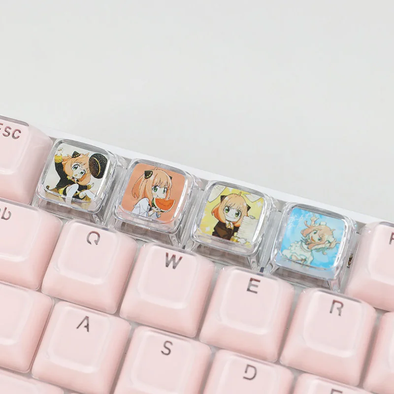 Playful Anya Transparent Keycap from SPY x FAMILY, captured at a unique angle, highlighting its iconic anime design and clear resin finish.