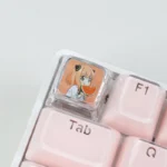 A playful Anya Transparent Keycap from SPY x FAMILY, showcasing its iconic character art and crystal-clear resin from a unique angle.