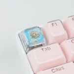 Playful Anya Transparent Keycap featuring the iconic SPY x FAMILY character, crafted from clear resin, viewed from a unique angle.
