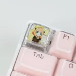 Playful Anya transparent keycap from SPY x FAMILY, showcasing vibrant anime art from multiple angles, highlighting its unique collectible design.