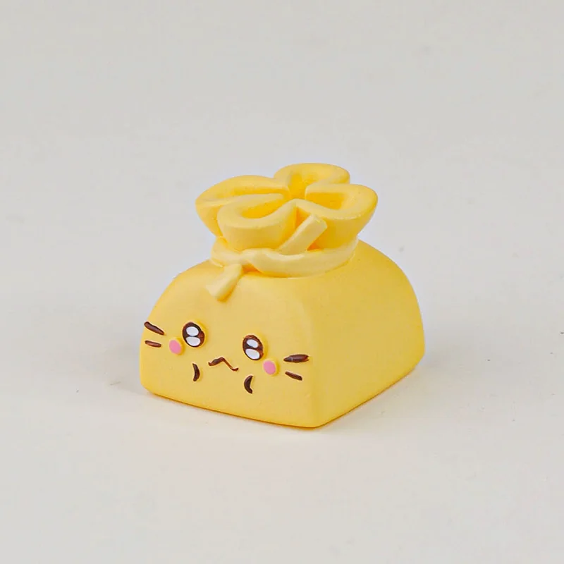 Whimsical Cat Oden resin artisan keycap depicting a playful cat holding a vibrant lucky bag filled with tiny food, a meticulously handcrafted keyboard.
