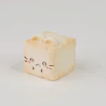 Handcrafted whimsical Cat Oden resin artisan keycap: a cute cat prepares a miniature old tofu dish. Vibrant, playful food art for your keyboard.