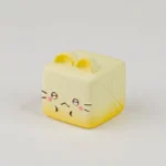 Whimsical Cat Oden resin artisan keycap featuring an adorable cat preparing a vibrant radish dish, meticulously handcrafted with charming details.
