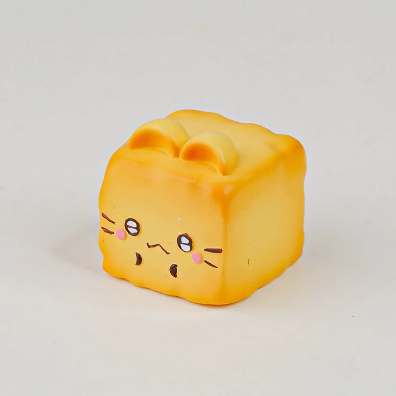 Whimsical handcrafted resin artisan keycap depicting a charming cat Oden proudly presenting miniature fish tofu, a delightful food-themed keyboard accent.
