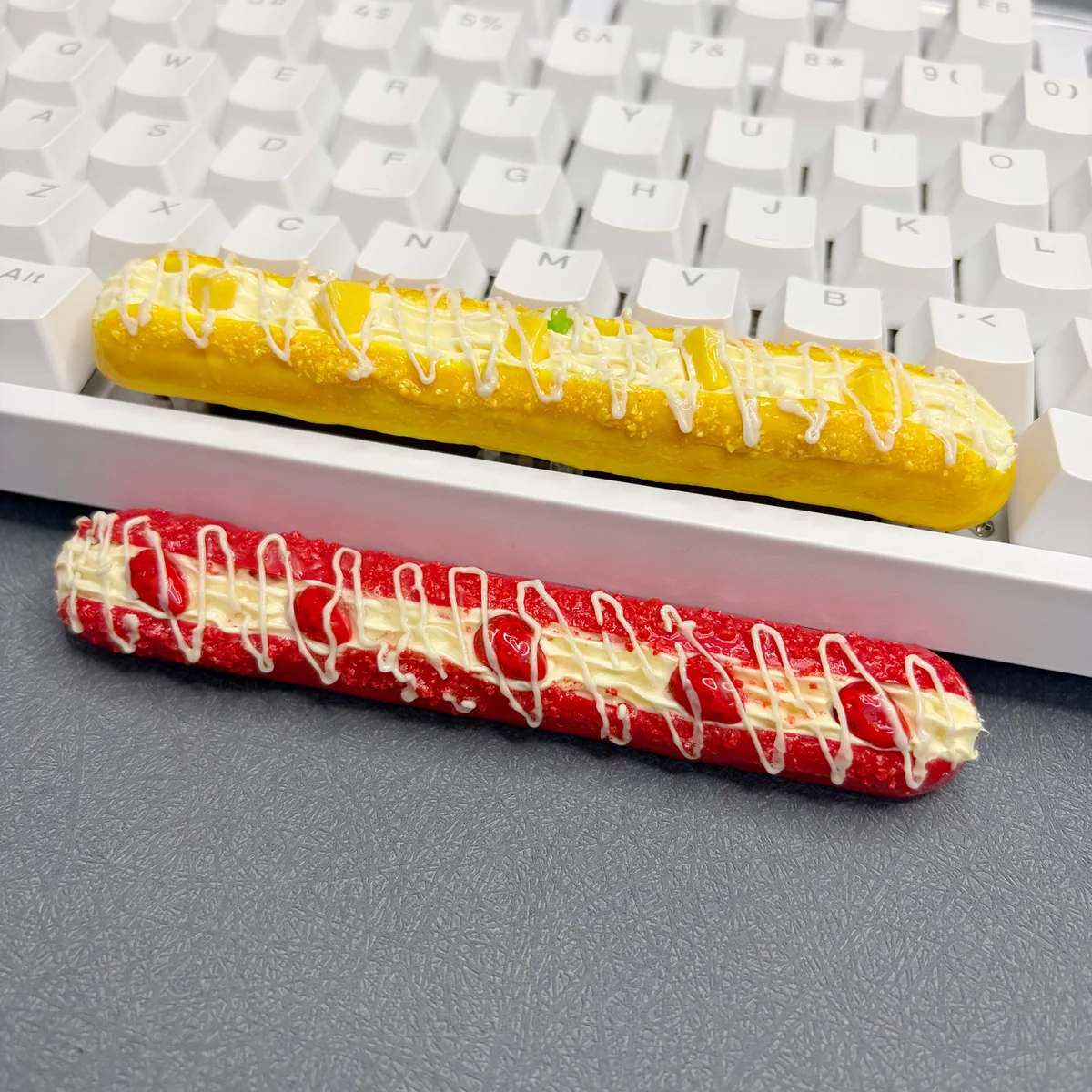 Close-up of the whimsical Baguette Artisan Spacebar Keycap 6.25u, showcasing its realistic, food-inspired texture and playful baked good design.