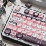 Discover the Sweetheart black pink cat PBT MOA keycaps set from all angles, revealing adorable black and pink dye-sub designs.