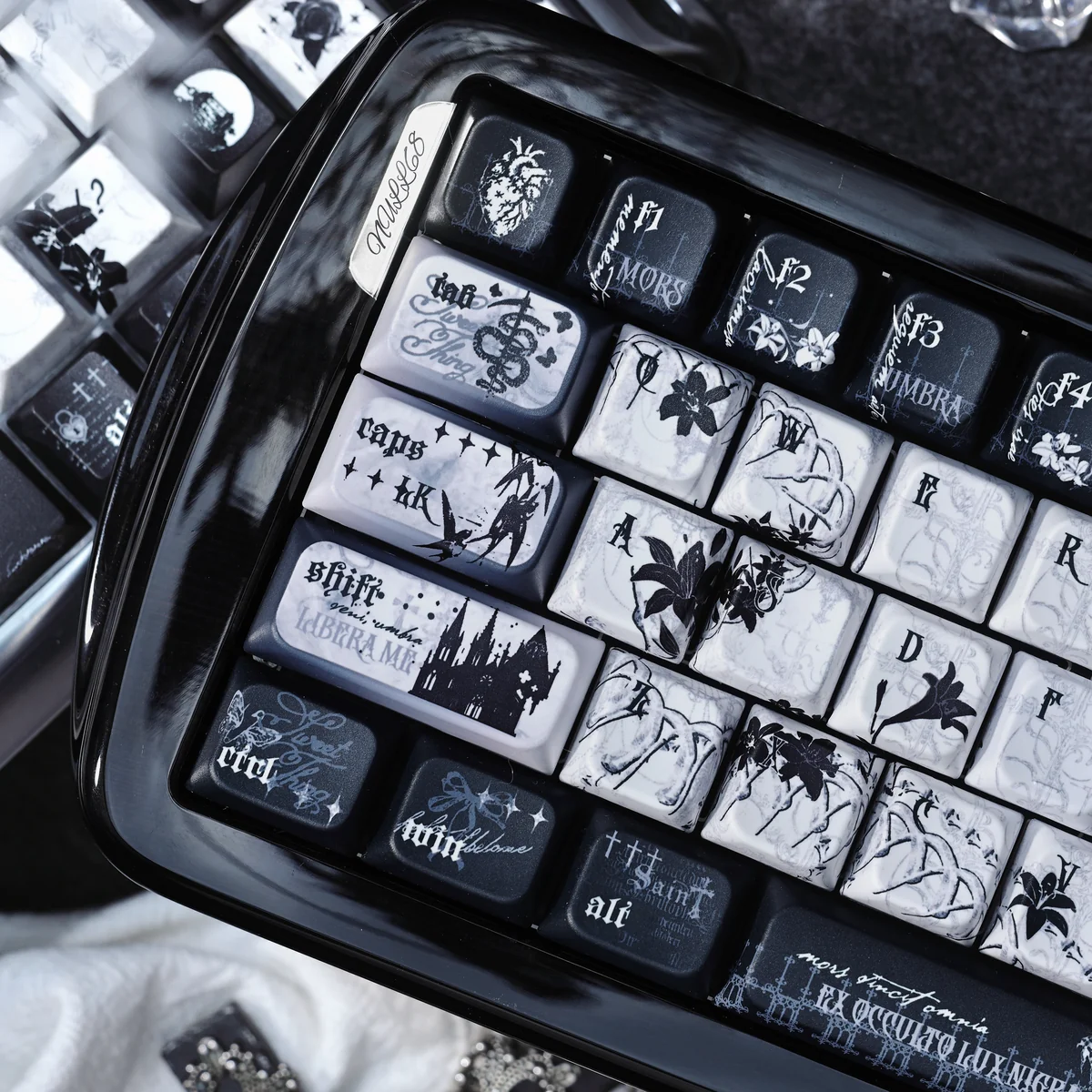 Black Requiem PBT keycaps from multiple angles, showcasing their dark, solemn gothic elegance. Intricate details define this unique premium keyboard.