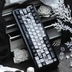 Multiple angles of the unique Black Requiem PBT keycap set, revealing its dark, gothic elegance and intricate legends with a premium finish.