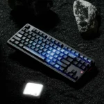 Close-up of stunning Blue Galaxy Keycaps showcasing their cosmic gradient and ethereal light refraction from a unique angle, perfect for a captivating keyboard.