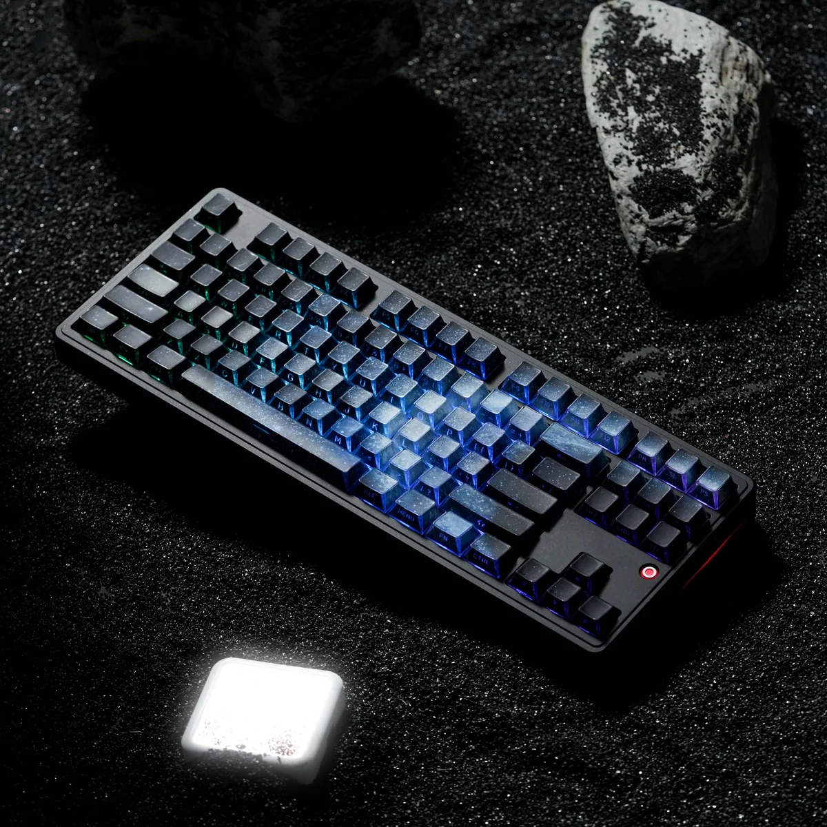 Close-up of stunning Blue Galaxy Keycaps showcasing their cosmic gradient and ethereal light refraction from a unique angle, perfect for a captivating keyboard.