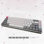 Vibrant pink Bubble Bobble MOA keycaps, showcasing iconic dragon characters and bubbly retro arcade designs from a playful angle, evoking nostalgia.