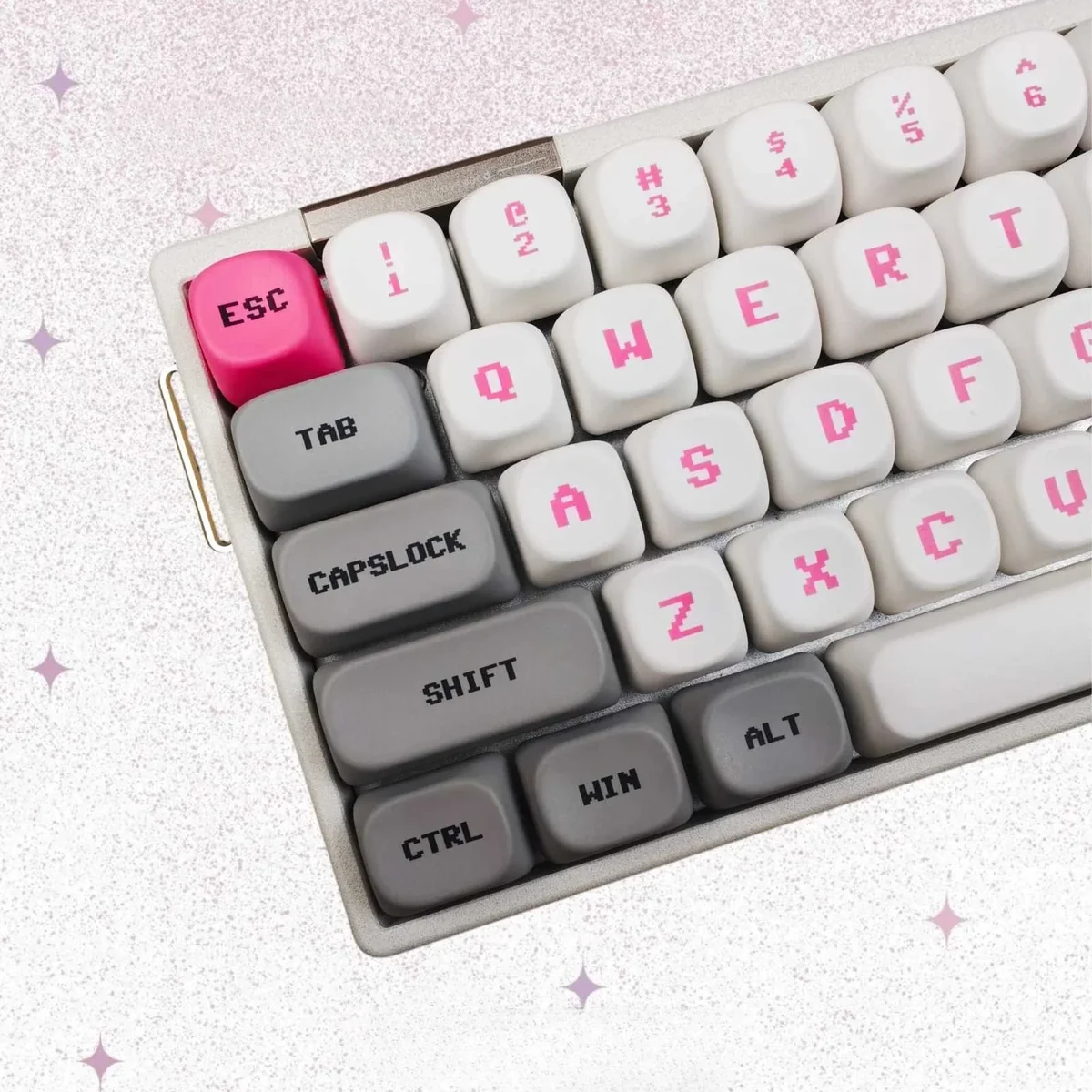 Vibrant pink Bubble Bobble MOA keycaps displaying iconic Bub and Bob characters, capturing playful retro arcade nostalgia from various angles.