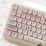 Close-up of bunny dessert PBT MOA keycaps set, featuring charming pastel bunnies and sweet treats from various playful angles.
