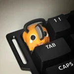 Adorable, vibrant Pochita keycap, a handcrafted 3D printed Q-version Chainsaw Man charm adding playful anime flair to your keyboard.