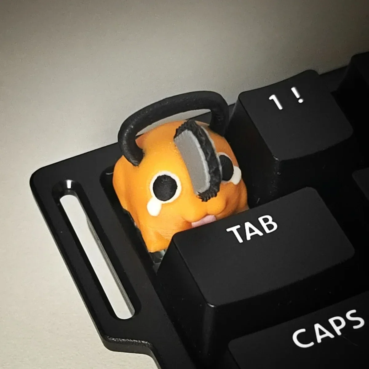 Adorable, vibrant Pochita keycap, a handcrafted 3D printed Q-version Chainsaw Man charm adding playful anime flair to your keyboard.