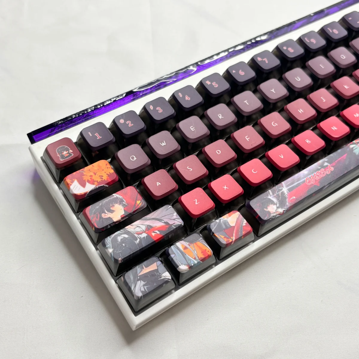 Artistic arrangement of Spectral Chisa Kuchiba MDA Wuthering Waves Keycaps, showcasing translucent PBT and vibrant RGB lighting on character.