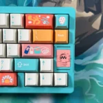 Vibrant Cinque Terre PBT Dye-Sub Keycaps set, showcasing various keys from multiple angles, capturing the artistic Italian coastal village charm.