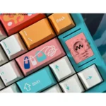 A vibrant collection of Cinque Terre PBT dye-sub keycaps, displayed from multiple artistic angles, capturing the picturesque charm of the Italian coast.