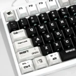Code Invasion Keycaps, showcasing the dark, futuristic hacker aesthetic from multiple angles with glowing side-printed hacker legends, perfect for a futuristic keyboard.