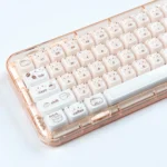 Close-up views of a whimsical handcrafted coffee kitten jelly artisan keycap set, showcasing its intricate design from various playful setup.
