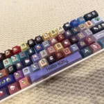 Playful Hellokitty PBT side-lit Cherry profile keycaps set, shown from multiple angles. Features iconic characters and crisp side-printed legends.